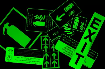 A group of custom labels on a black background.