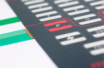 A close up of a keyboard with custom labels on its buttons.