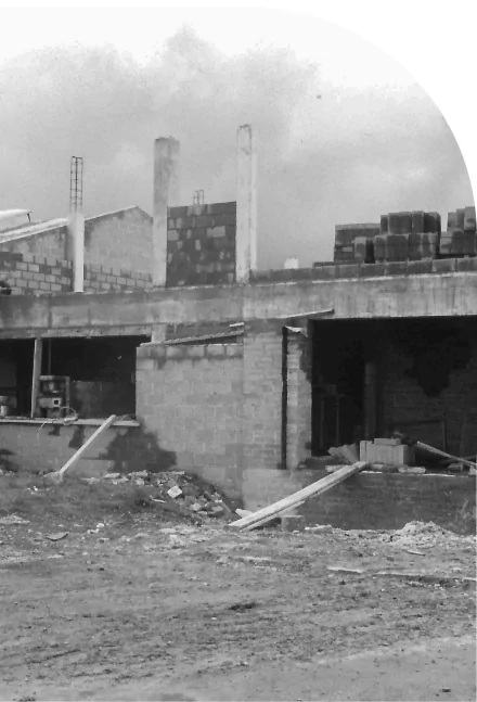 A high quality black and white photo of a building under construction.