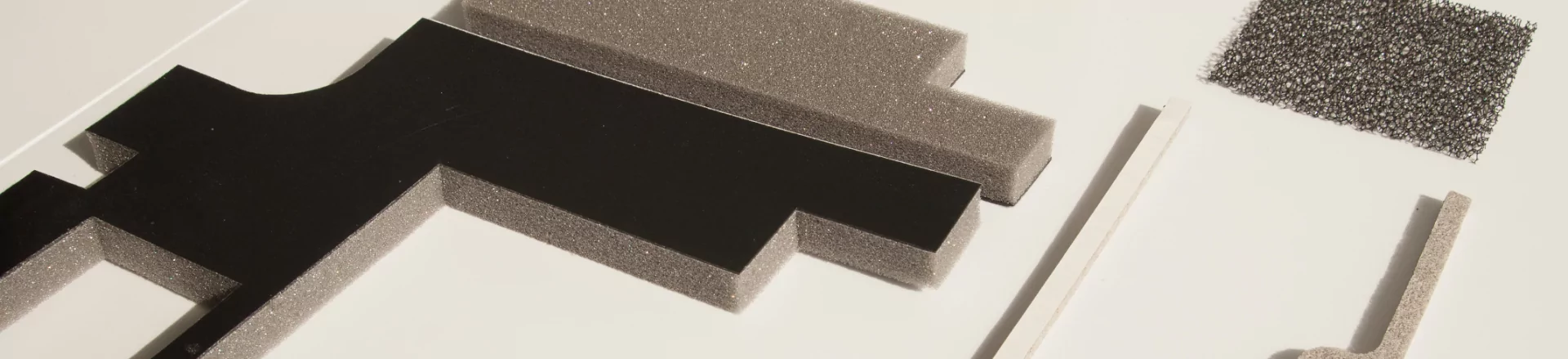 A group of custom label solutions on a white surface.
