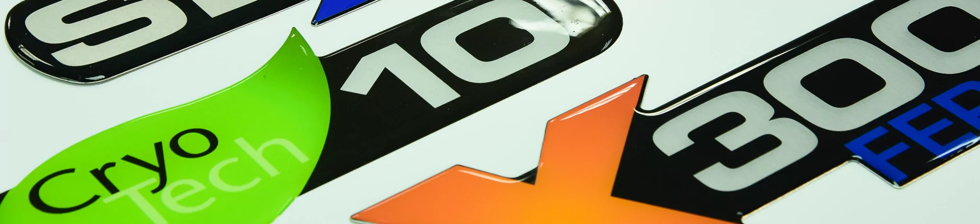 A close up of several different custom label solutions on a wall.
