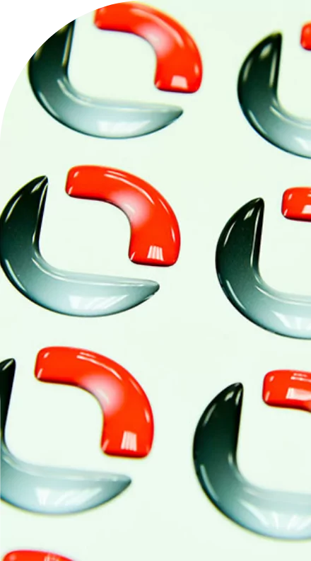 Red and black medical labels on a white surface.