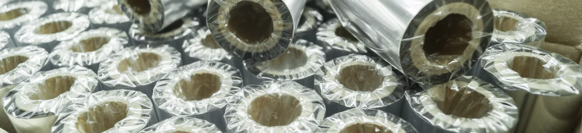 A roll of aluminum foil with custom label solutions.
