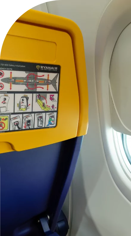 A custom labeled airplane seat with a window.